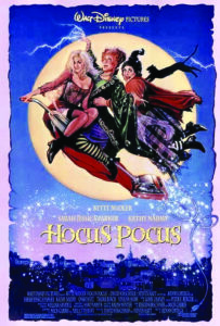 Movie poster with witches flying on a broom in front of a full moon