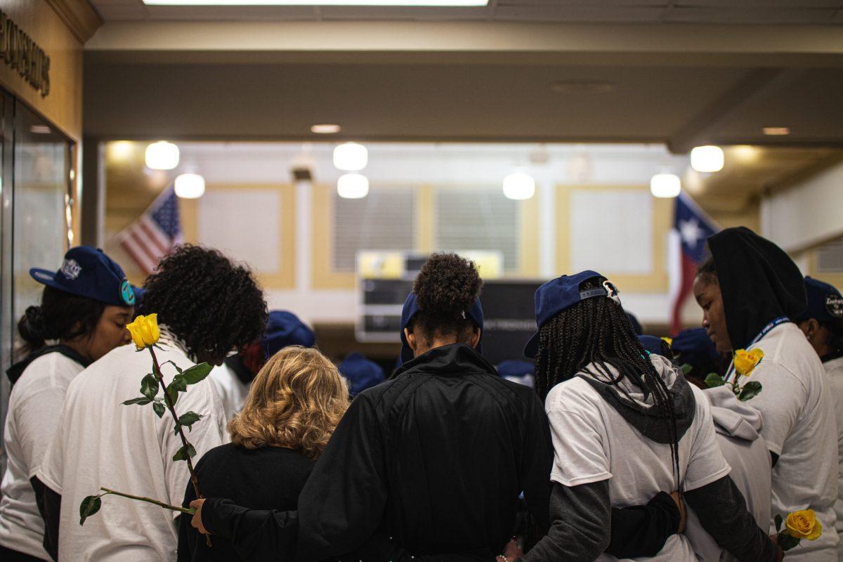 players gather to pray in wagstaff gym