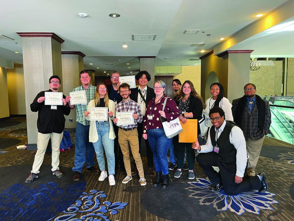 DrumBeat staff poses at TIPA convention with awards