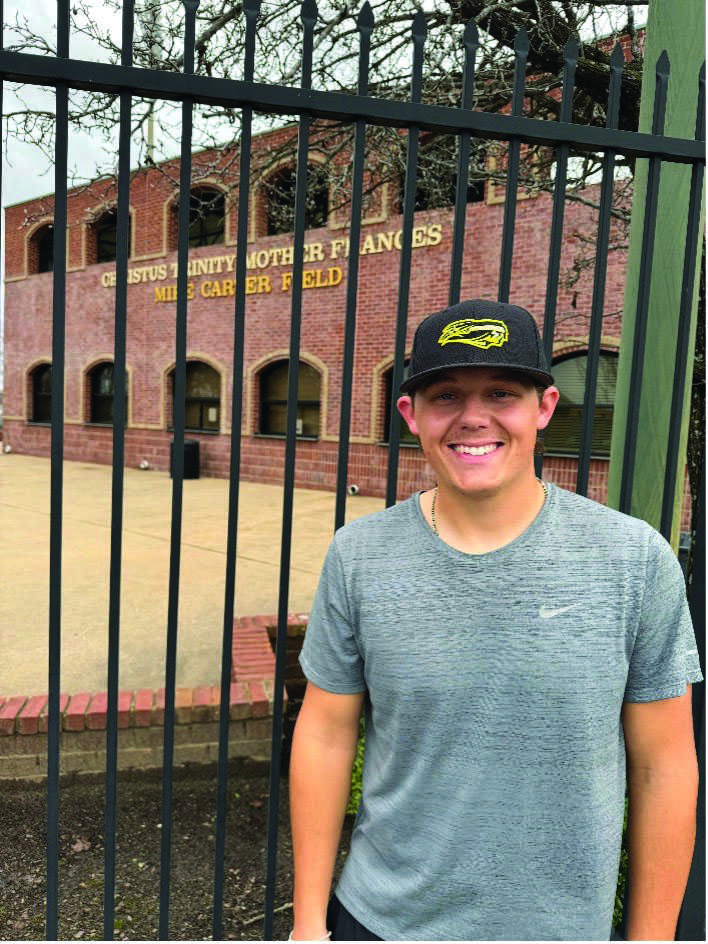 Austin Huml is standing outside of Mike Carter field, the home of the TJC Apache baseball. He manages a full-time job, baseball and school.