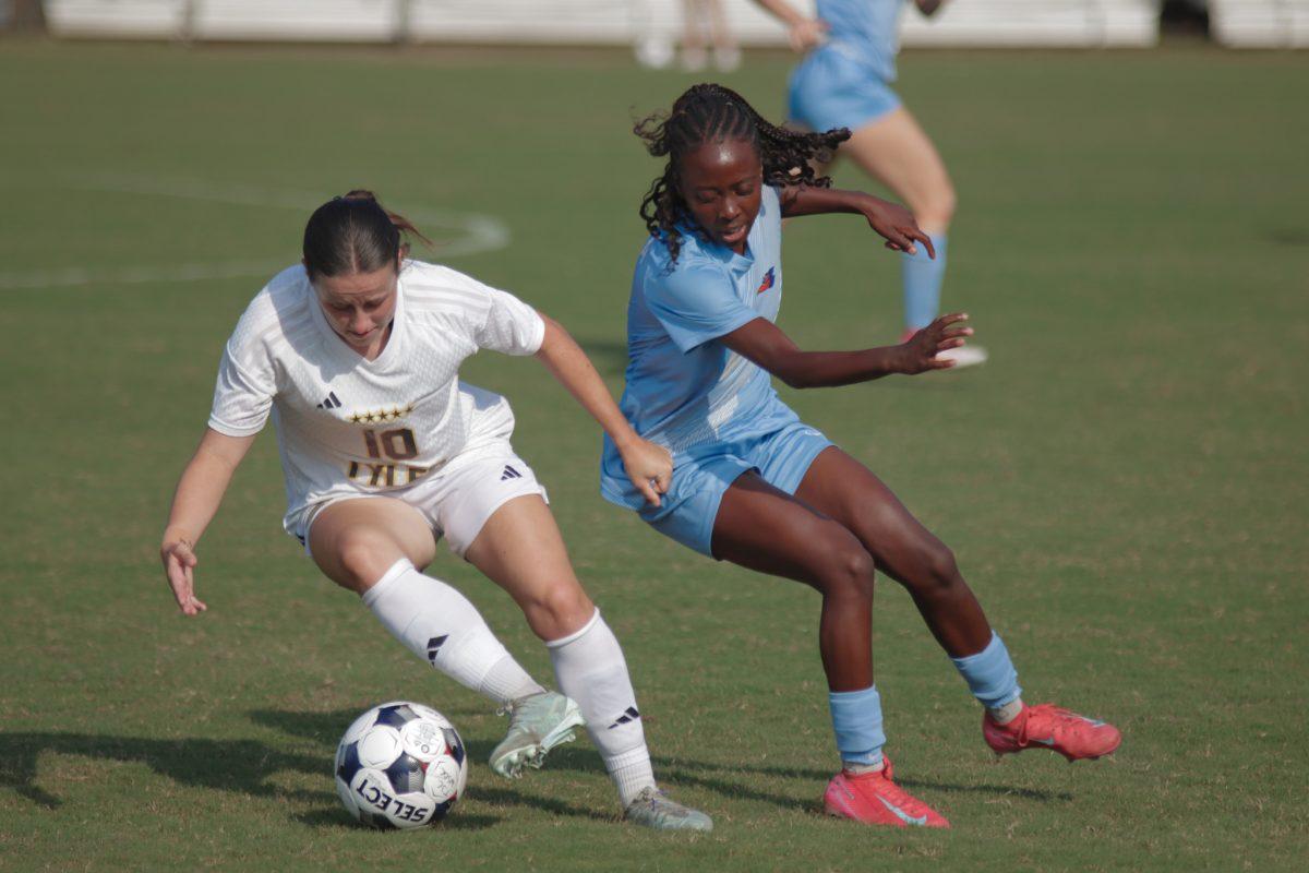 Anna Powell (10) works the ball past her opponent. Photo by Ian Frye