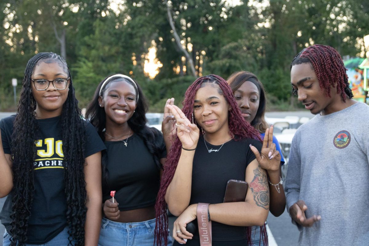 Feathers up! Tjc Students during Homecoming Parade