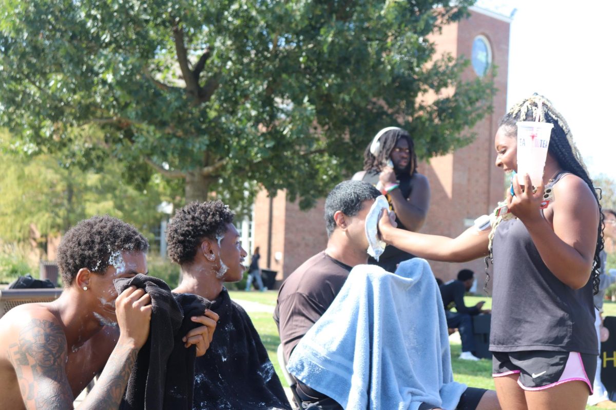 From right to left
Hanzlah Rana (Communications) getting pied during homecoming. He's joined by Jamari Evans (General Studies) and Lawrence Taylor (Business)
