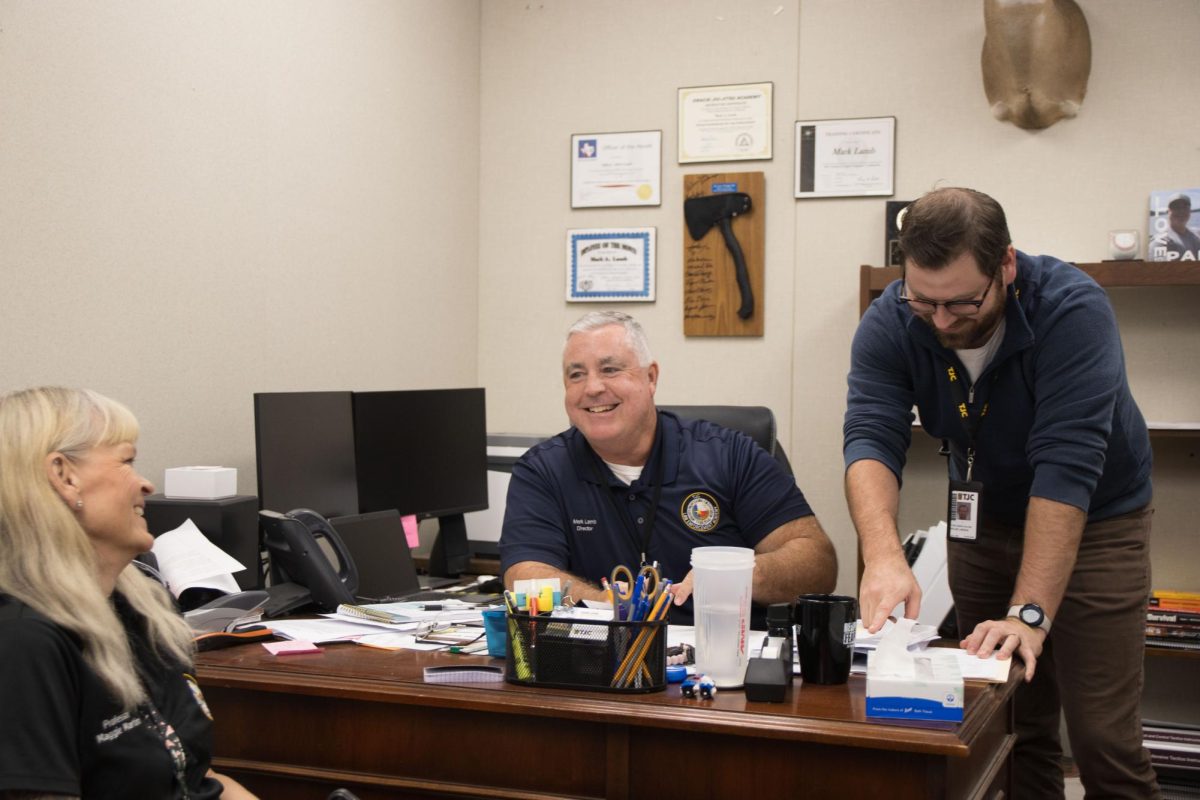 Police Academy Directors office at TJC West Campus. Director Lamb and his instructors are caught here interacting and laughing. From left to right Maggie Martin (Instructor) Mark Lamb (Director) and Taylor Bogue (Instructor)