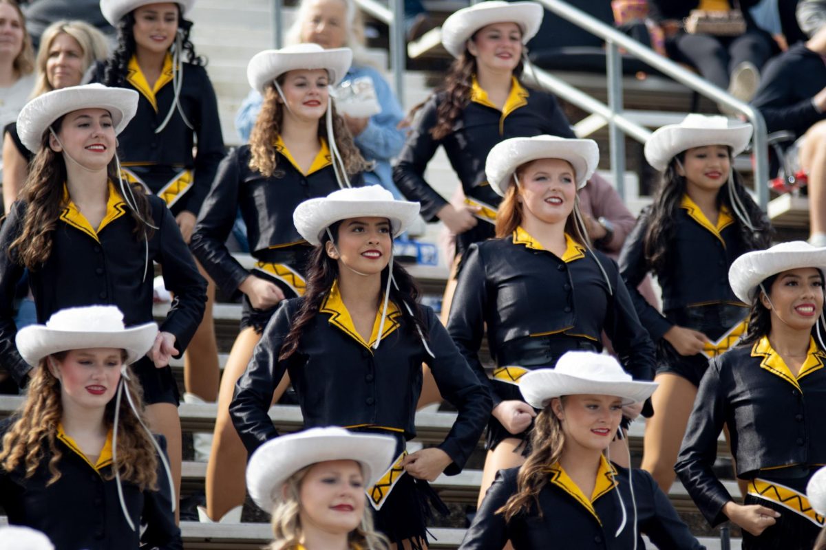 Photo by Ian Frye. The Apache Bells in the stands cheering on the Apaches side.  Apache Belles members in this photo include Jorja Flake, Riley D'Elena, Kayln O'Conner, Emily Ibarra, Jadelyn Chavez, Addison Maroney, Ava Puron, Ashley Blair, Shira Strohl, Jaci Sterenson, and Stacey Gonzalez. Photo taken on November 1, 2025.