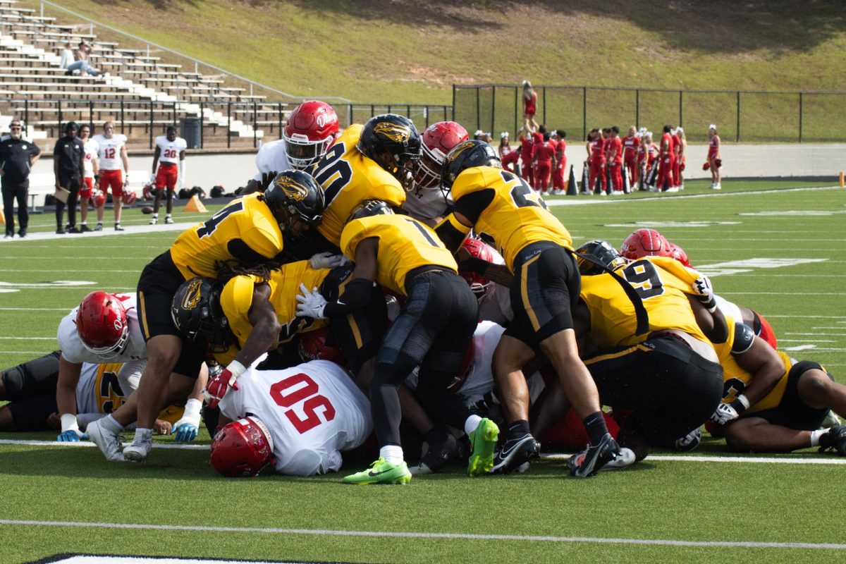 Photo by Ian Frye. TJC and Navarro Dogpiled on the field. Winning this game has secured The TJC Apaches a spot in the playoffs. Photo taken on November 1, 2025.