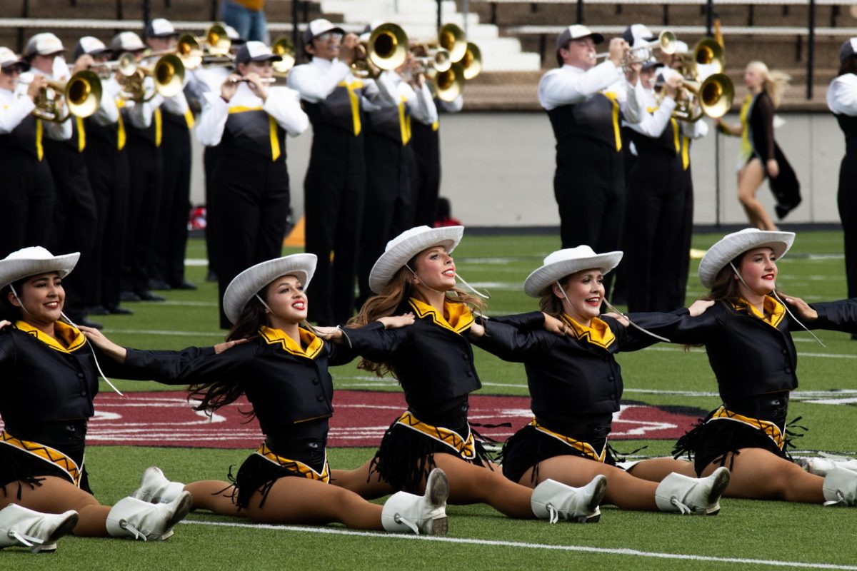 Photo by Ian Frye. The Apache Bells performing at halftime. Apache Belles members in this photo include Litzy Hernandez, Natalia Rawlinson, Baylie Clark, Brooklynn King, and Abby Weaver. Photo taken on November 1, 2025.