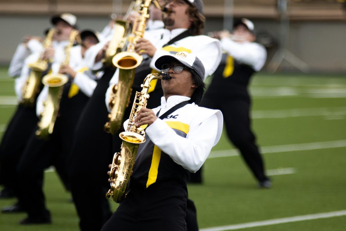 Photo by Ian Frye. Band member playing the saxophone during halftime. The Apaches won the game against Navarro (20-14). Photo taken on November 1, 2025.
