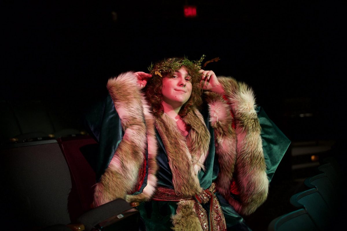 Colby Crawford repositions his wreath as he poses for the camera. As the fur of his costume glistens in the light, so does Crawfords smile and willingness to complete his life puzzle. Piece by piece. Photo taken by Adriana Salazar Gomez.