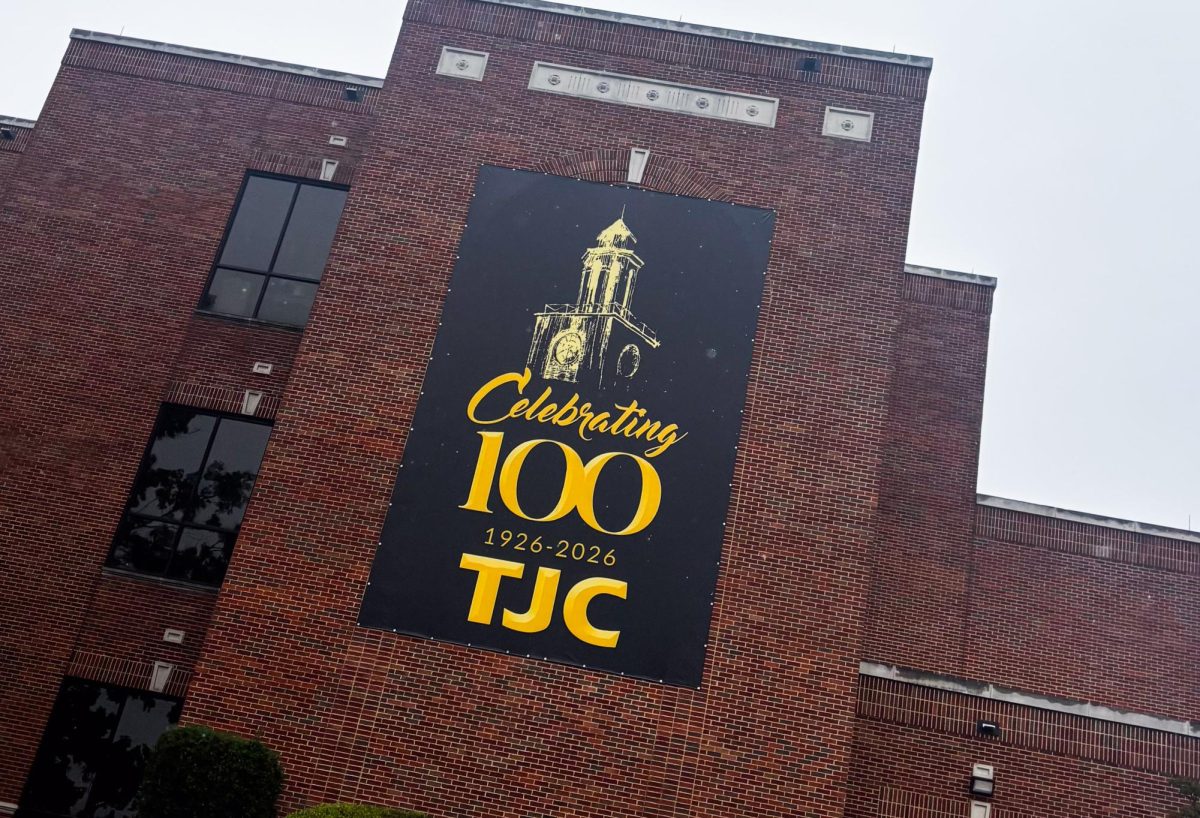 Celebrating 100 banner hanging on TJC's White Administration Services building. This year, 2026, TJC is celebrating its 100-year anniversary.